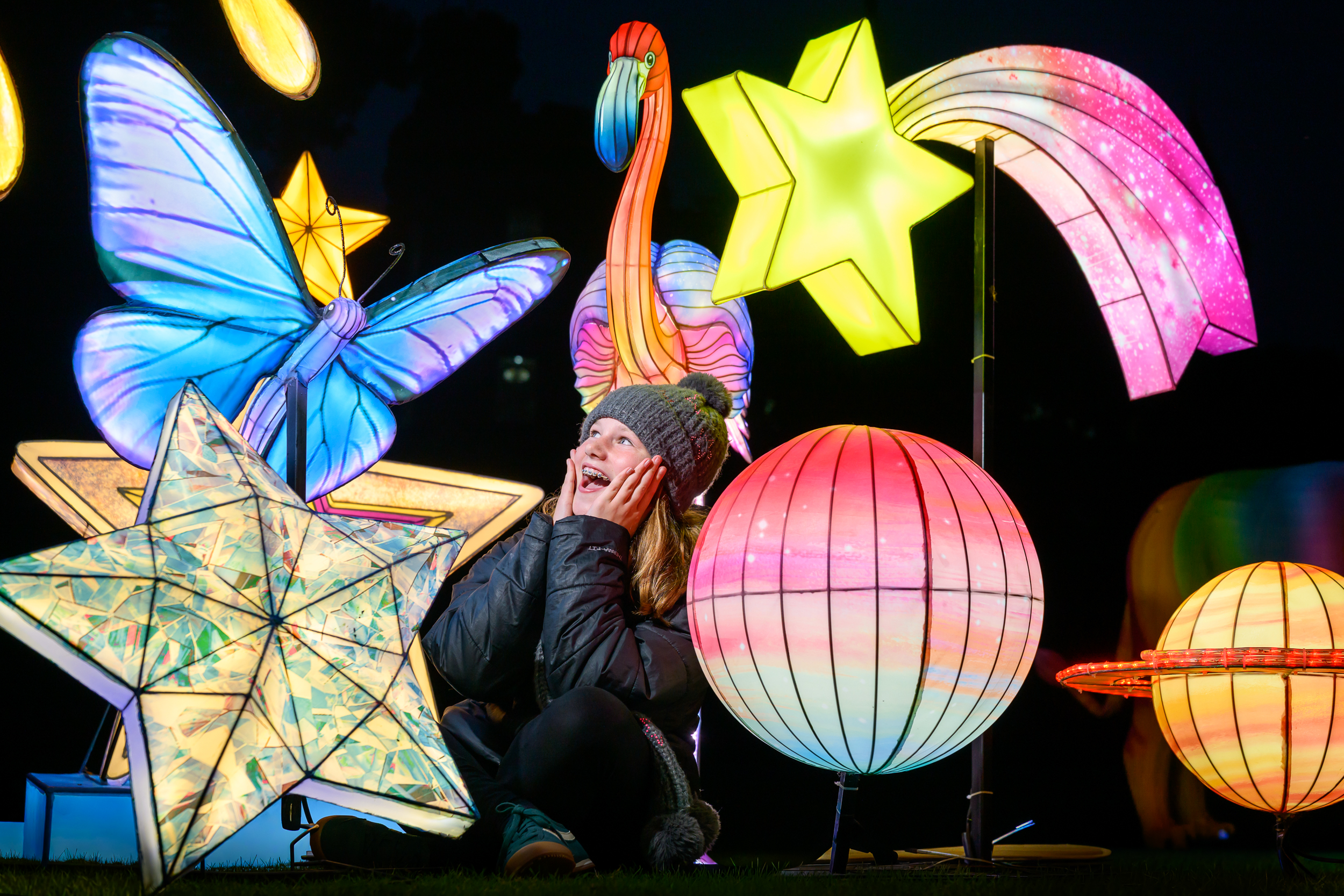 Visitor sitting amongst space themed lanterns IMAGE Ian Georgeson 2026