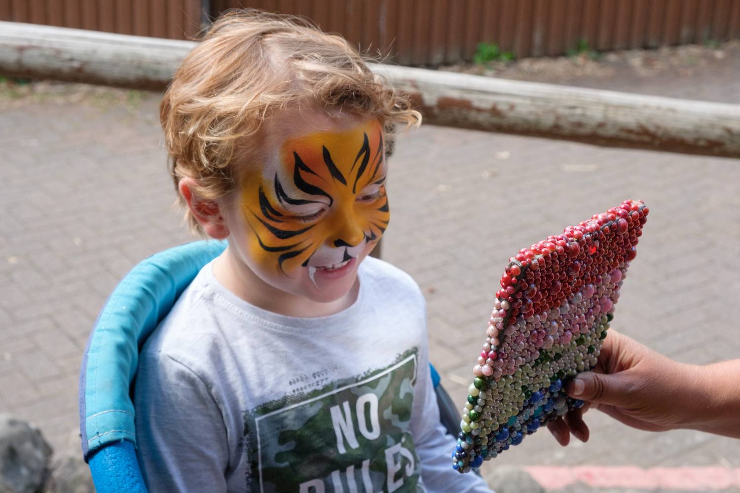 Edinburgh Zoo visitor kid (boy) getting face painted. IMAGE: Robin Mair 2022.jpg