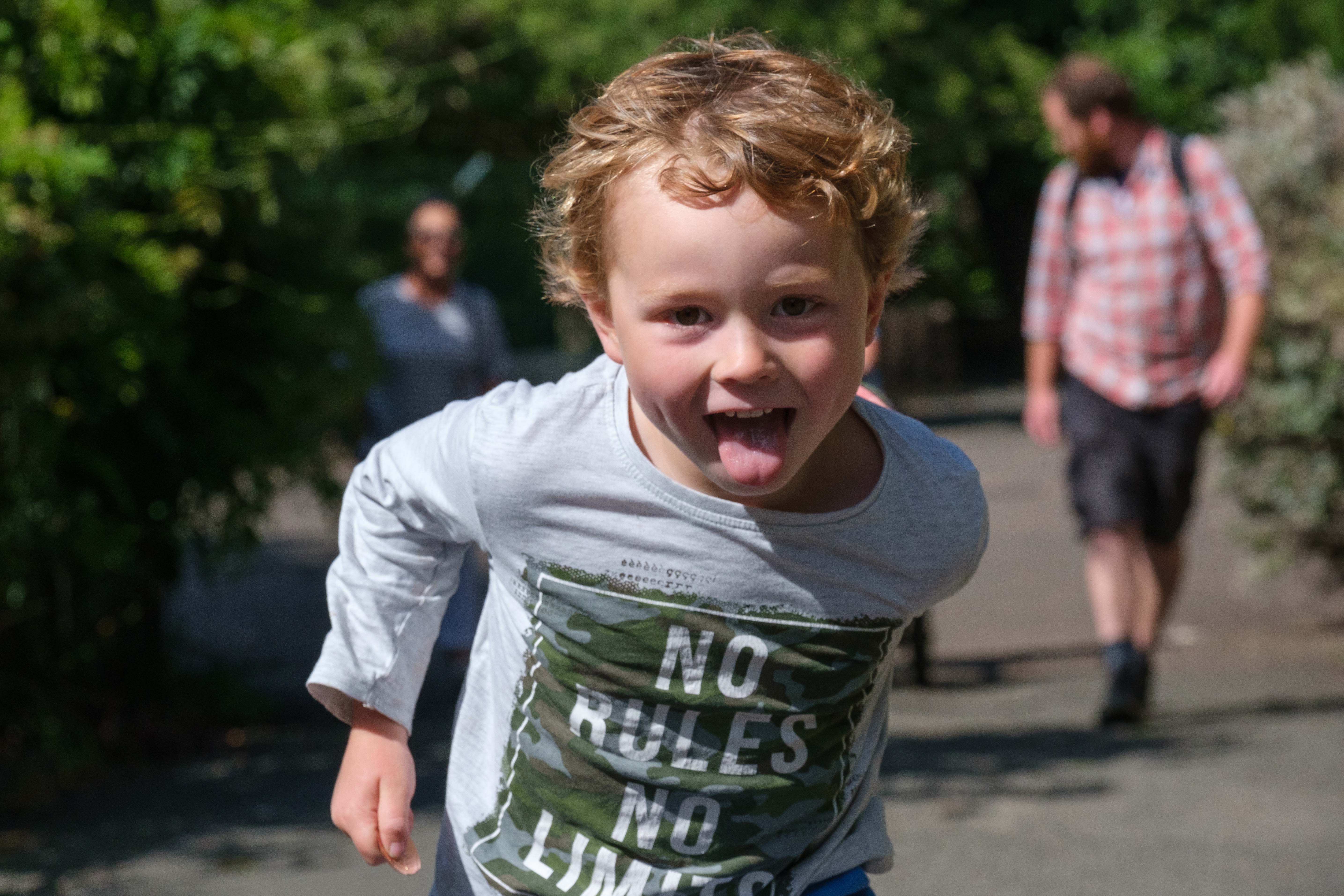 Child running towards camera with tongue out IMAGE: Robin Mair 2022