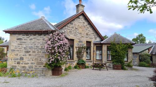 highland country cottages meadowside house with flowers