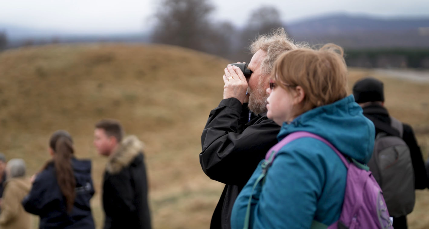 Visitors looking through binoculars at polar bears IMAGE: FoSho 2023