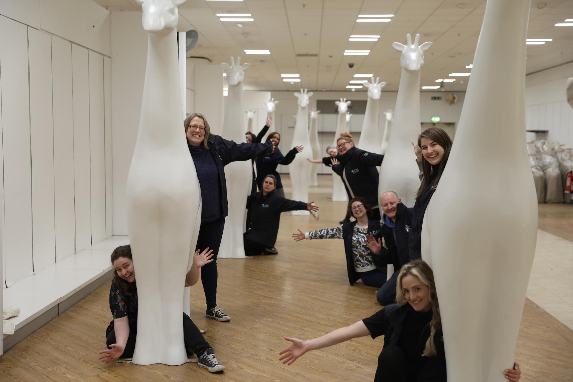 RZSS staff pose with blank giraffe about town statues after arrival at Ocean Terminal workshop

Image: SARAH SIA 2022