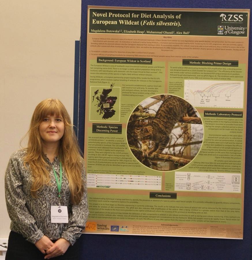 Magda Butowska standing beside poster presenting research findings at the ConsGen22 Conference in Edinburgh