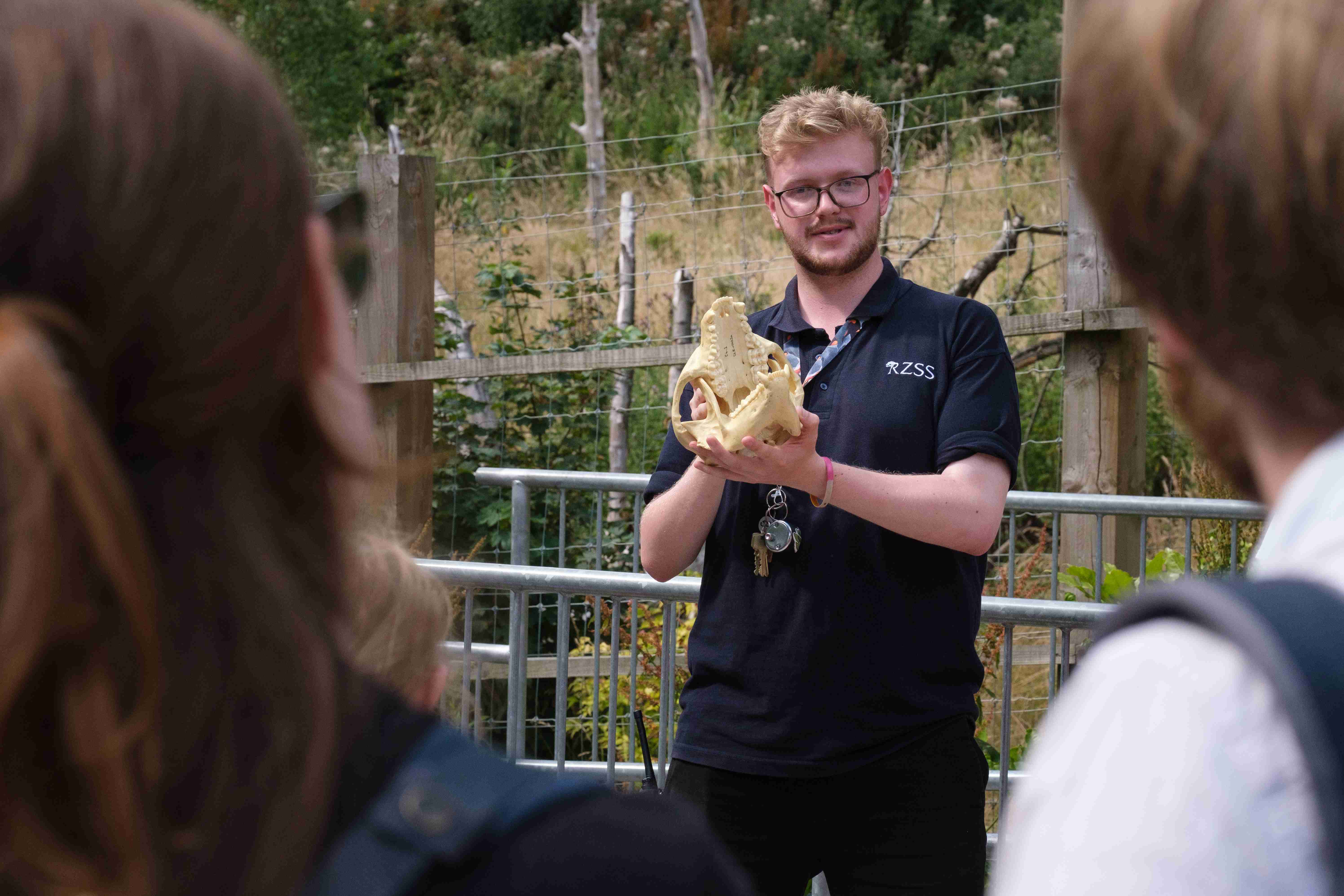 Discovery ranger Maurice Hickman giving talk holding animal skull

IMAGE: Robin Mair