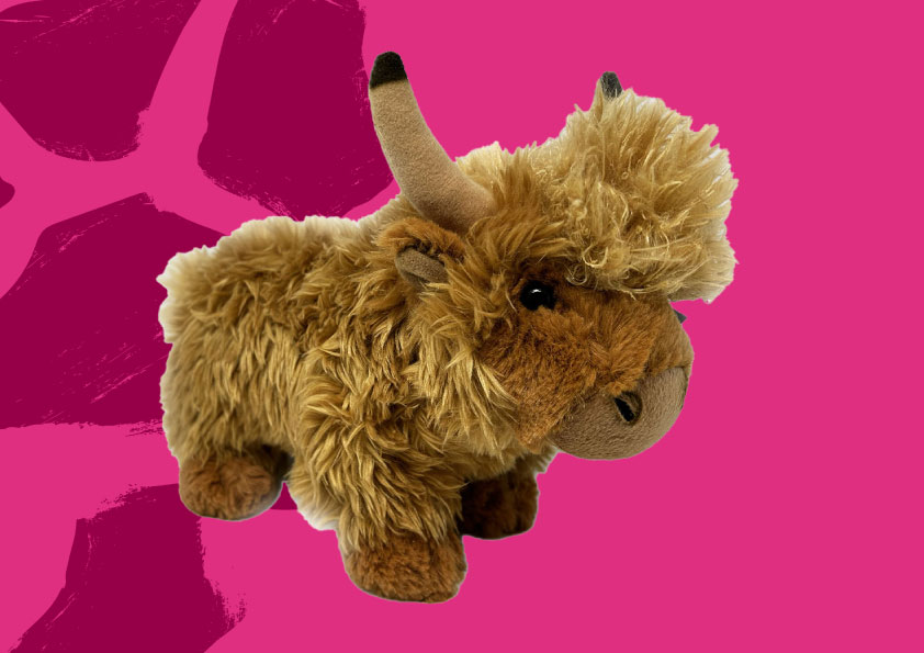 highland cow soft toy on pink background with pattern