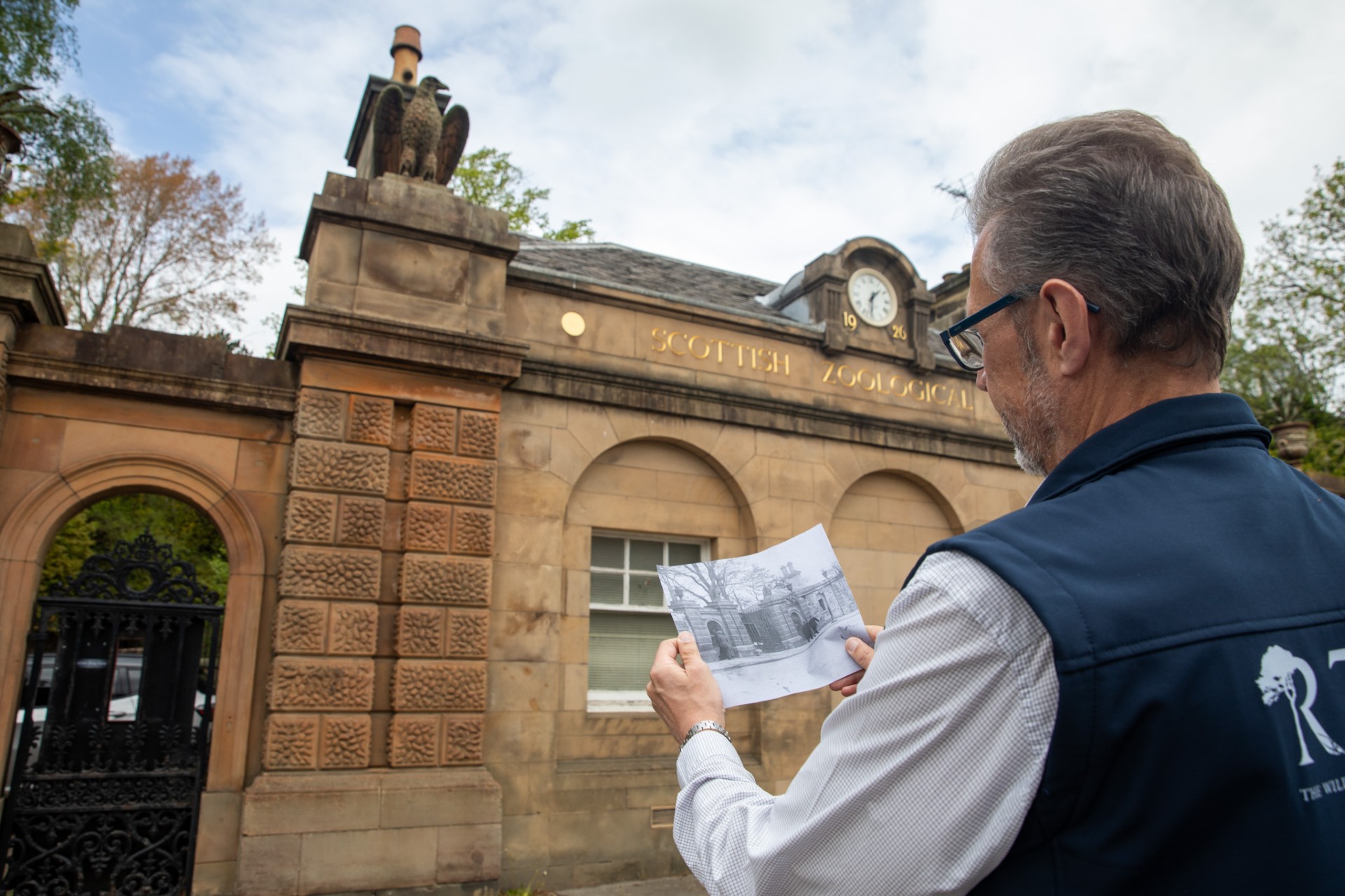 RZSS CEO David Field comparing an archival photo with the current scene IMAGE RZSS 2026
