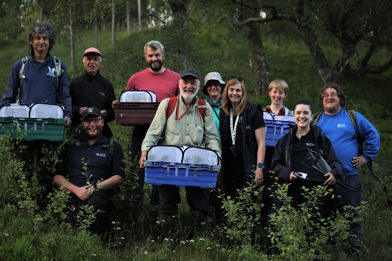Group of people from RZSS and BugLife at dark bordered beauty moth release IMAGE: Jess Wise 2023