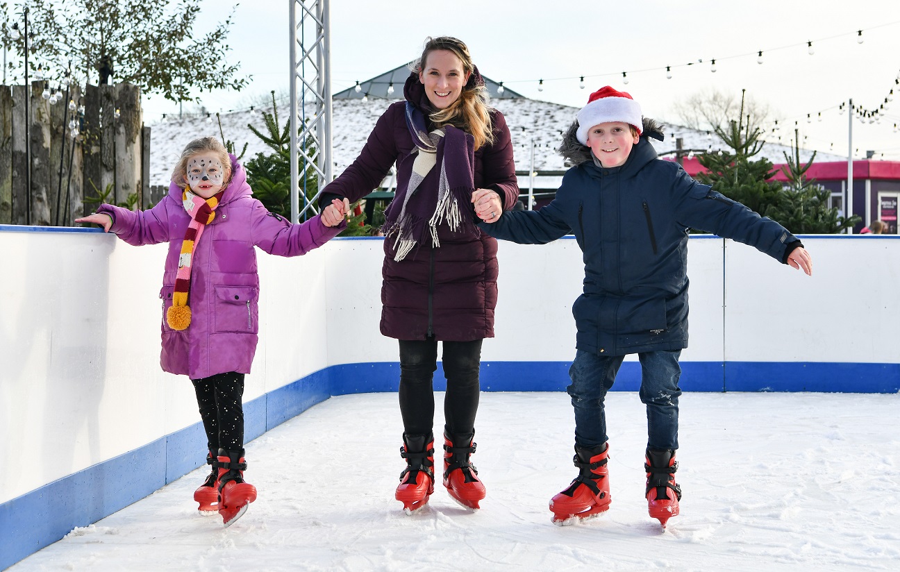 Mother with two children. They are ice skating at Twycross Zoo IMAGE: Twycross Zoo (2022)