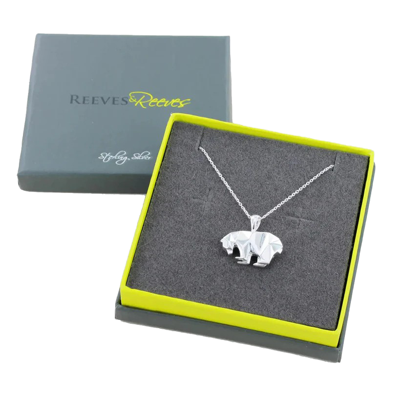 silver polar bear necklace in box IMAGE: Retain 2024