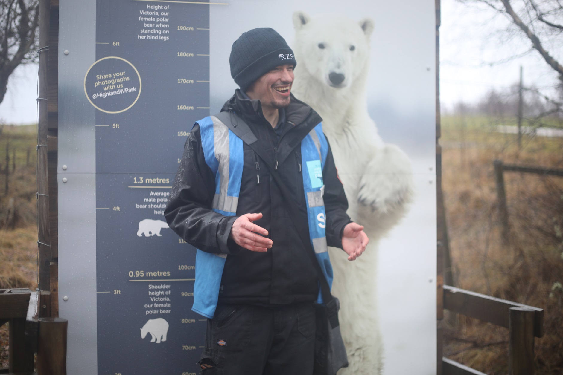 Ranger Dane stood in front of polar bear signage giving a talk IMAGE: Allie McGregor 2023